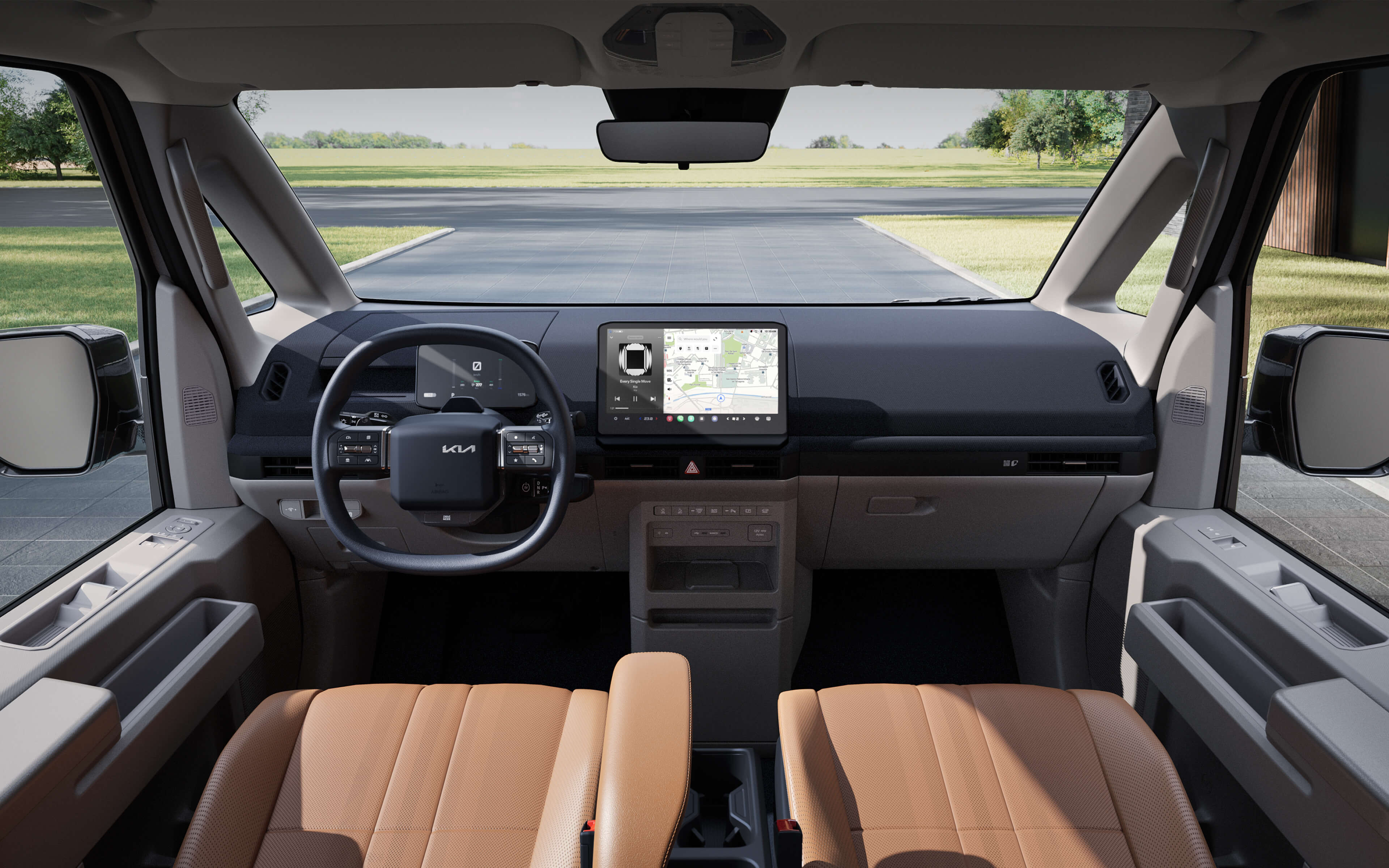 Vordere Innenansicht des Kia PV5 Passenger mit Blick auf die große Sichtweite der Windschutzscheibe, das beheizbare Lenkrad und die strapazierfähigen Sitzmaterialien für den täglichen Gebrauch
